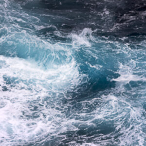 A wild ocean scene consisting of waves, with dark blue, aqua and white colours