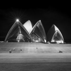 a black and white photo of the Sydney Opera House taken during Covid lockdown